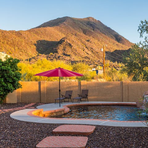 Cool off in the pool surrounded by desert mountains