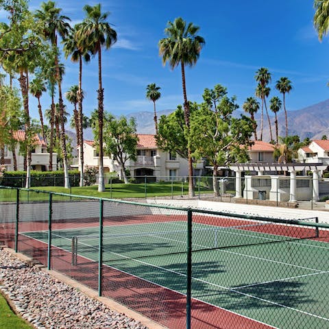 Play a few rounds of tennis on the courts