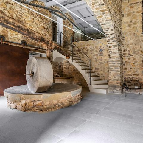 Witness history kept alive with the ancient olive press in the entrance hall