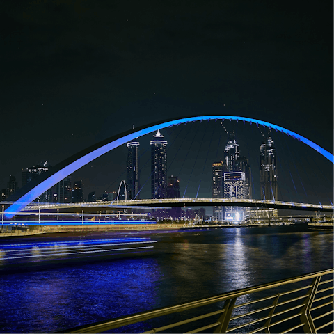 Explore Dubai, including the nearby Dubai Canal Boardwalk