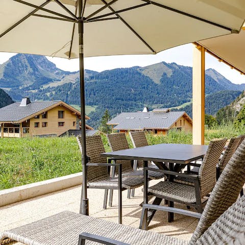 Dine and recline in the private patio to a sublime mountain view