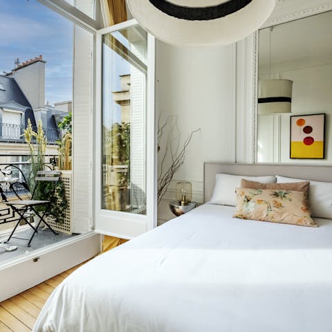 Wake up to Avenue Victor Hugo views in the cosy bedroom