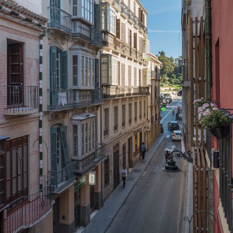 Admire views of Malaga's old city with a glass of wine