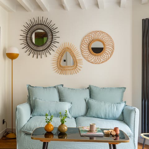Kick back in the boho-chic living area with a glass of wine after a day of Paris sightseeing