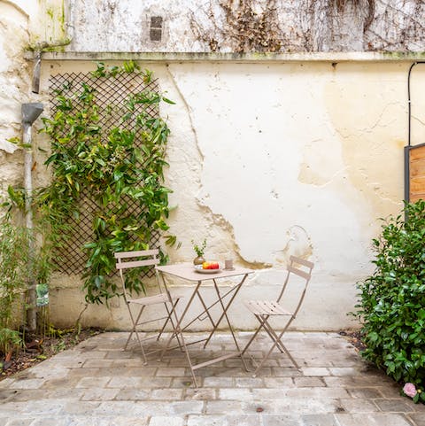 Enjoy your morning coffee and croissants alfresco in the courtyard garden