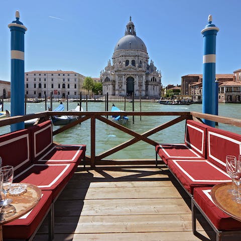 Watch the gondolas pass by as you enjoy a glass of Prosecco on your private terrace