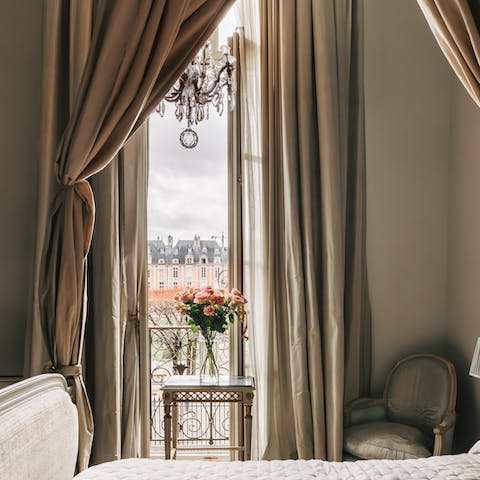 Take in the incredible views over Place des Vosges from your Juliet balcony