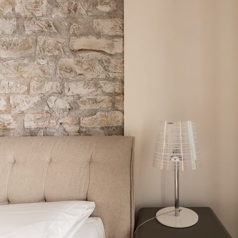 The exposed brickwork in the bedroom