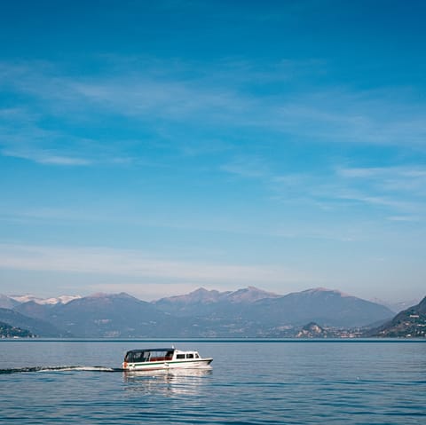 Rent a boat and explore the idyllic nearby Lake Como