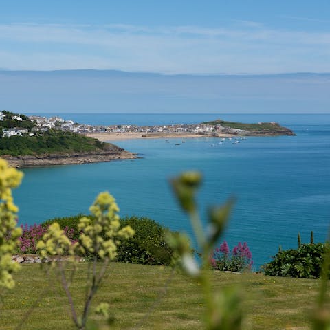 Experience the atmospheric charm of Carbis Bay with this home overlooking the beach