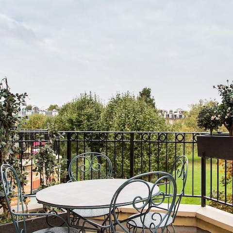 Enjoy your morning coffee on the private balcony overlooking Formosa Garden park