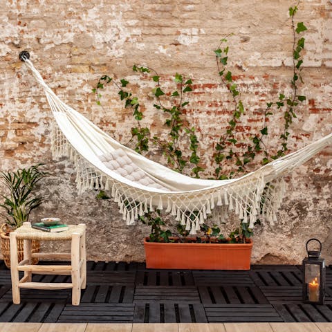 Hang out in the terrace's hammock with a good book while catching some rays