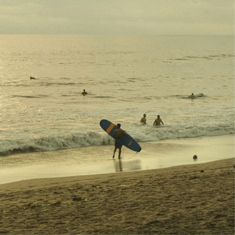 Catch some waves at Seminyak beach