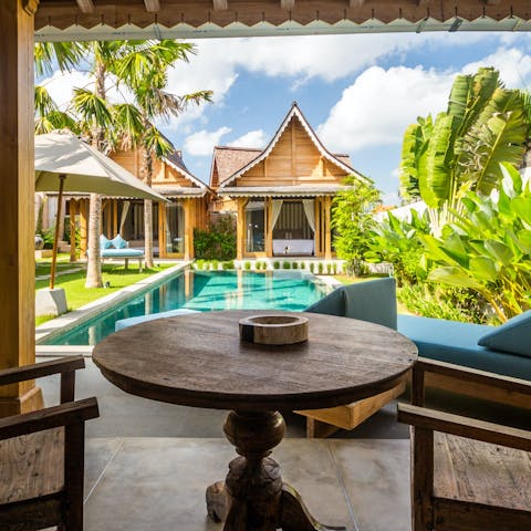 Start your day with breakfast on the terrace amid the lush vegetation