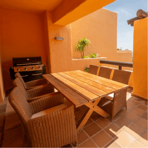 Fire up the barbecue and feast on grilled Spanish meats on your alfresco dining set