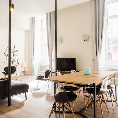 Admire the bright apartment's tall ceilings and huge windows
