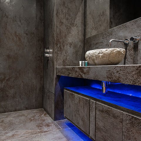Start mornings off with a relaxing soak under the spa-like bathroom's shower