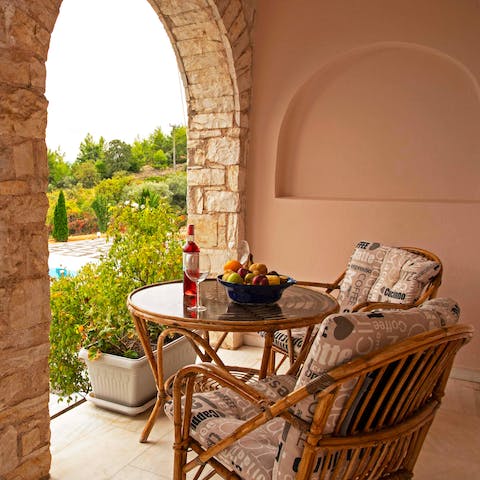 Sit out with a drink and a snack on the terrace and gaze out at the countryside of the Athenian Riviera