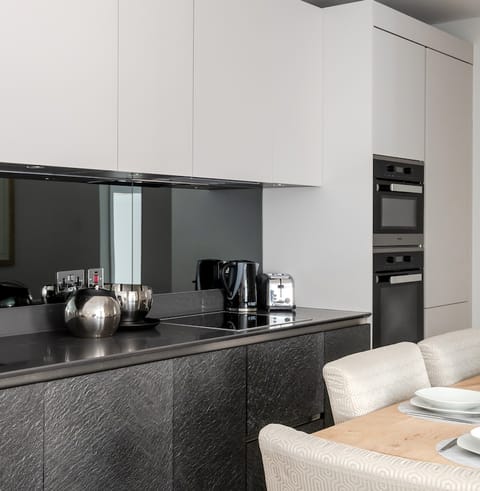 Cook your meals in the sleek kitchen with Miele appliances
