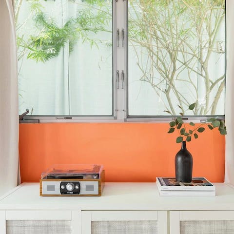 Listen to your favourite tunes on the retro-style record player