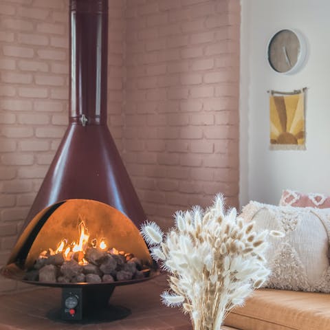 Keep the desert chill at bay with the working fireplace
