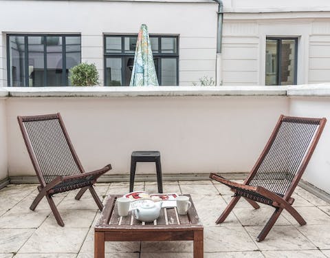 Enjoy a glass of French wine out on your private terrace, after a day of exploring the sights of Paris