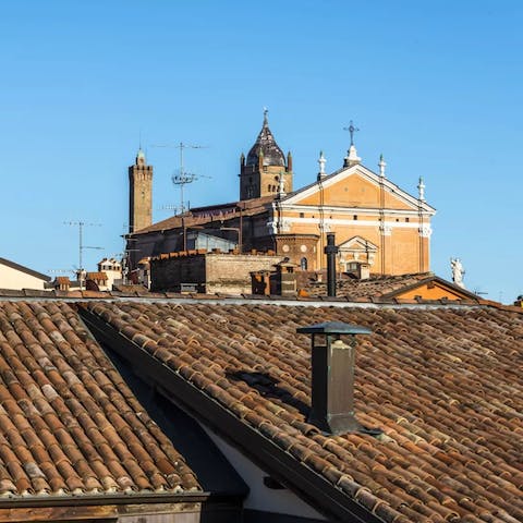 Admire views of Bologna's roofscape and the Basílica de San Pedro