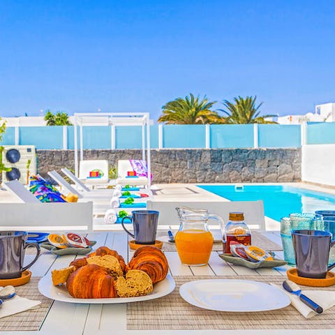 Enjoy every meal poolside under the sun in the shade of the terrace