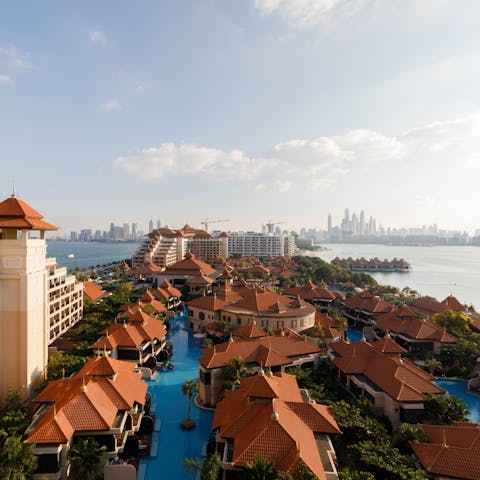 Gaze out over the resort towards the towering city skyscrapers from your private balcony