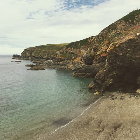 Head to the secret bays and walking paths of the Roseland Heritage Coast, a ten-minute drive