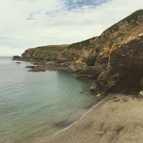 Head to the secret bays and walking paths of the Roseland Heritage Coast, a ten-minute drive 