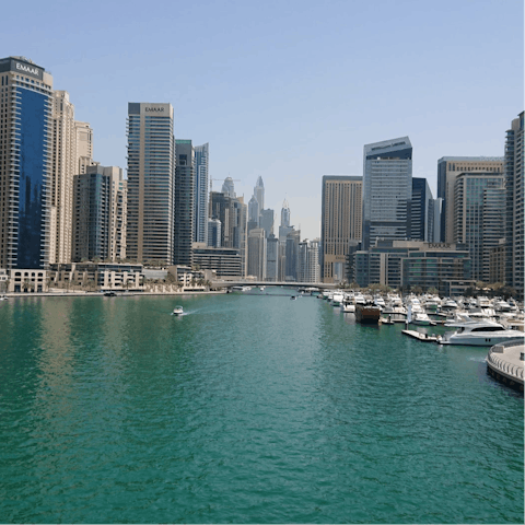 Stroll along Dubai Marina promenade, a twenty-minute walk away