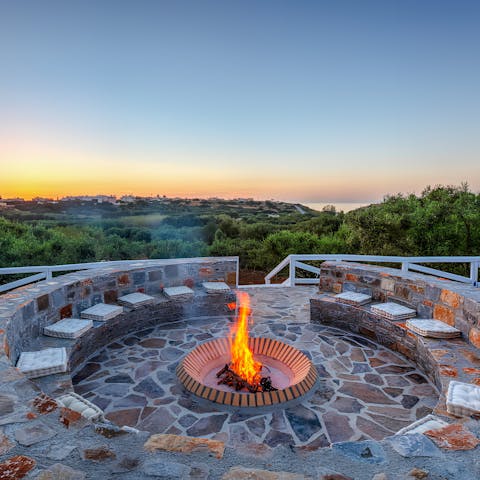 Sip cocktails around the fire pit as the sun begins to set