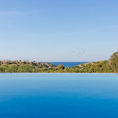 Admire stunning sea views from the heated infinity pool