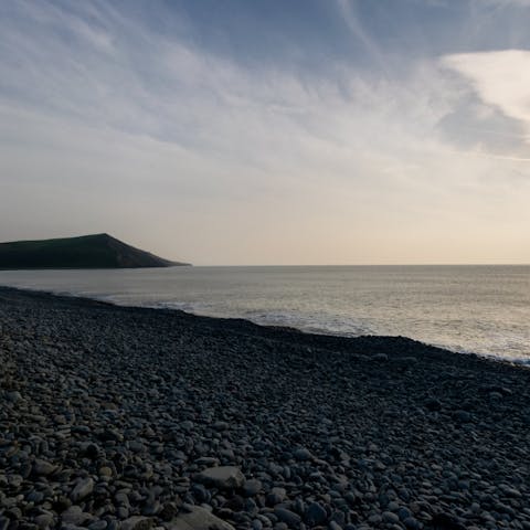 Wander along the pebbled beach –⁠ just three-minutes from your door