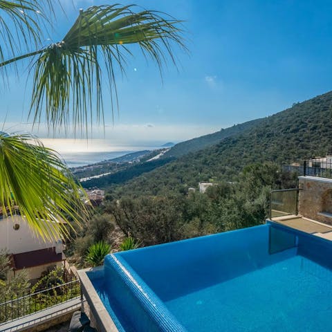 Gaze at the panoramic vistas from the infinity swimming pool