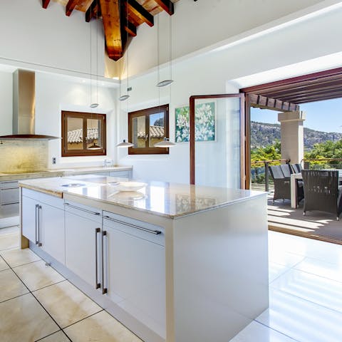 Cook up a feast for friends and family in the massive kitchen with sweeping views of the coast