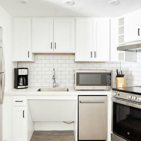 Fire up the coffee machine in the sleek, modern kitchen