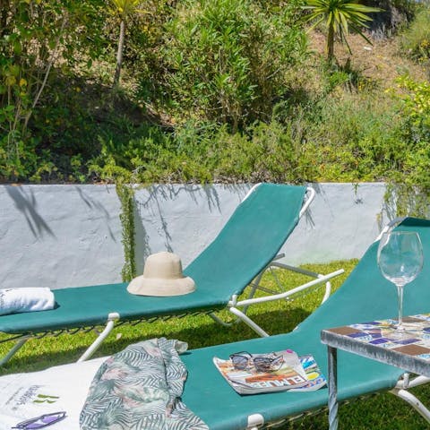 Flop down on a sun lounger with a good book and a cool drink