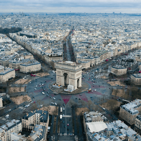Soak up the vibrant heart of Paris from the Arc de Triomphe
