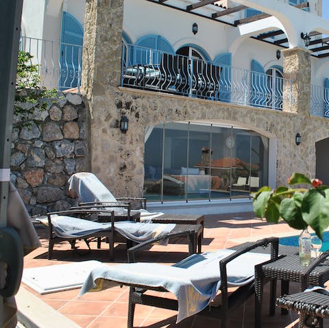 Soak up the Cypriot sunshine on the terrace loungers 