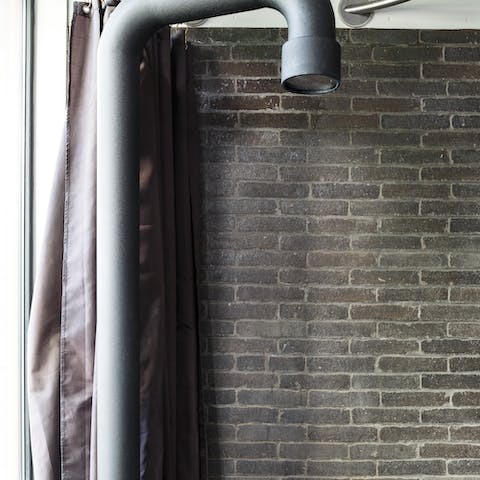 Start mornings off with a soak under the industrial-style shower