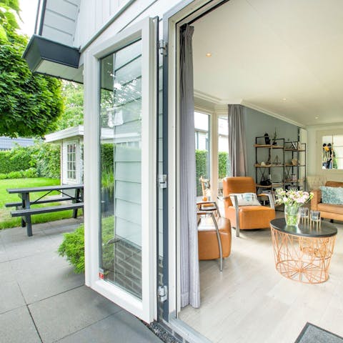 Throw open the double doors to let a breeze waft into the bright living space