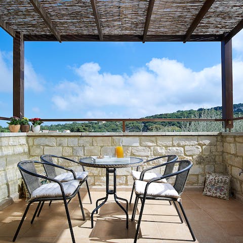 Plan your day over breakfast up on the covered balcony, with far-reaching views