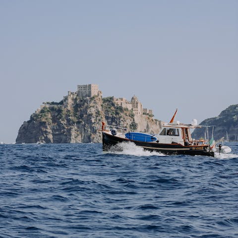 Take a boat tour of the Bay of Naples and discover stunning sites like the Castello Aragonese