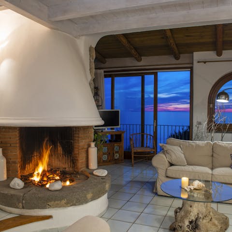 Relax and unwind by the fireplace with a glass of Italian wine