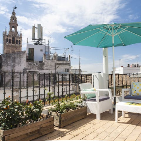 Enjoy a glass of Spanish wine on your private patio at the foot of the Cathedral