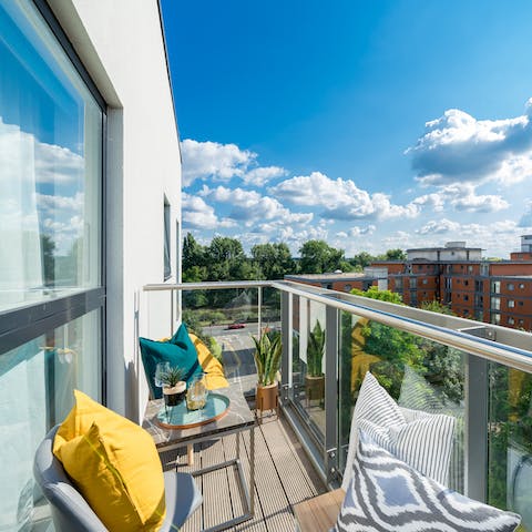 Watch riverside life unfold from your private suntrap balcony