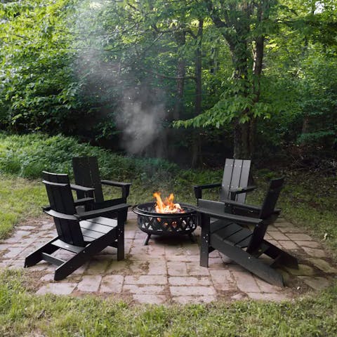 Pull up one of the Adirondack chairs and light the fire pit in the garden