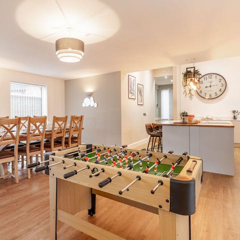 Challenge a guest to game of foosball 